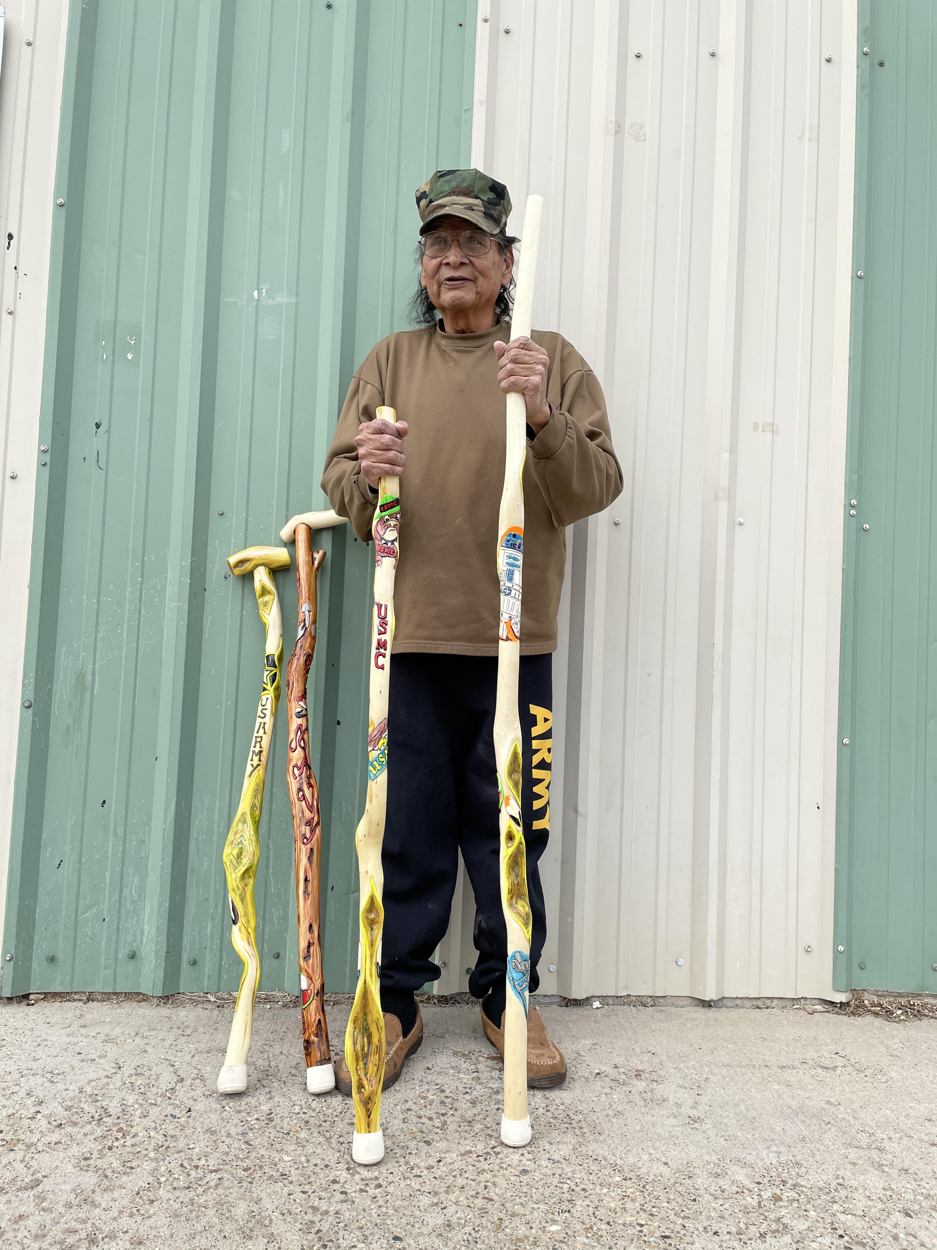 A photo of William White, a local artist and veteran specializing in handmade wood carving and diamond willow walking sticks.