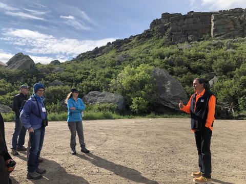 Photo of George Horse Capture, Jr., Tourism Director, leading a walking tour.